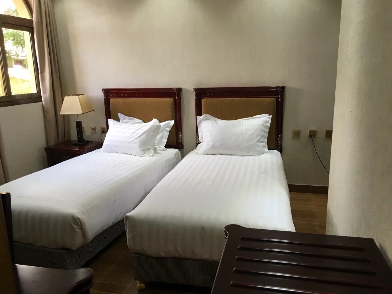 Standard twin room with two single beds and white linen